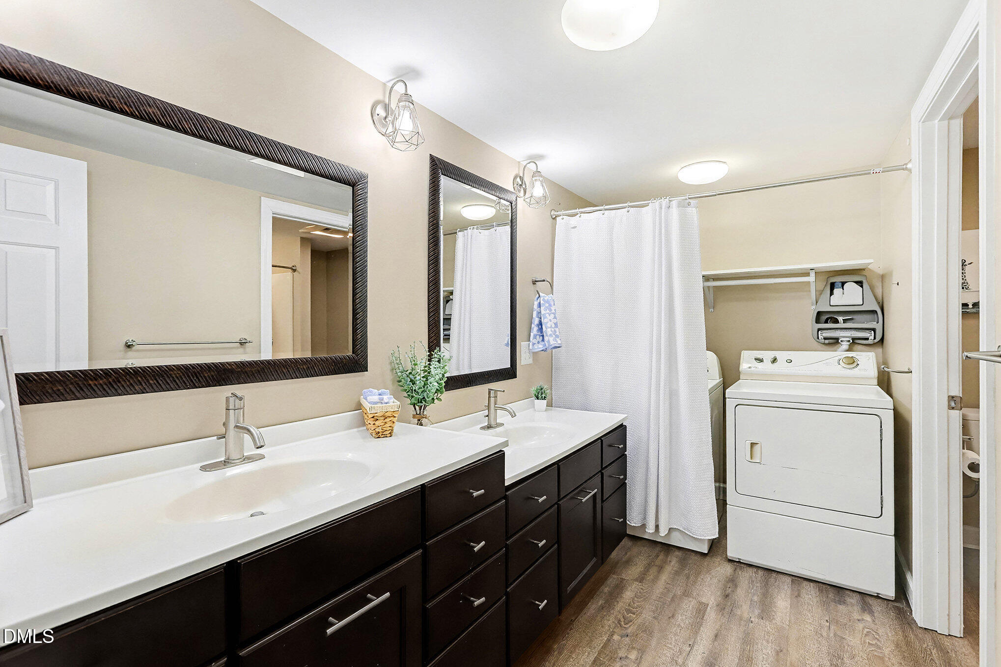 7228 Cleveland School Road Garner, NC 27529 - Photo 19 of 28 a bathroom with a double vanity sink and mirror