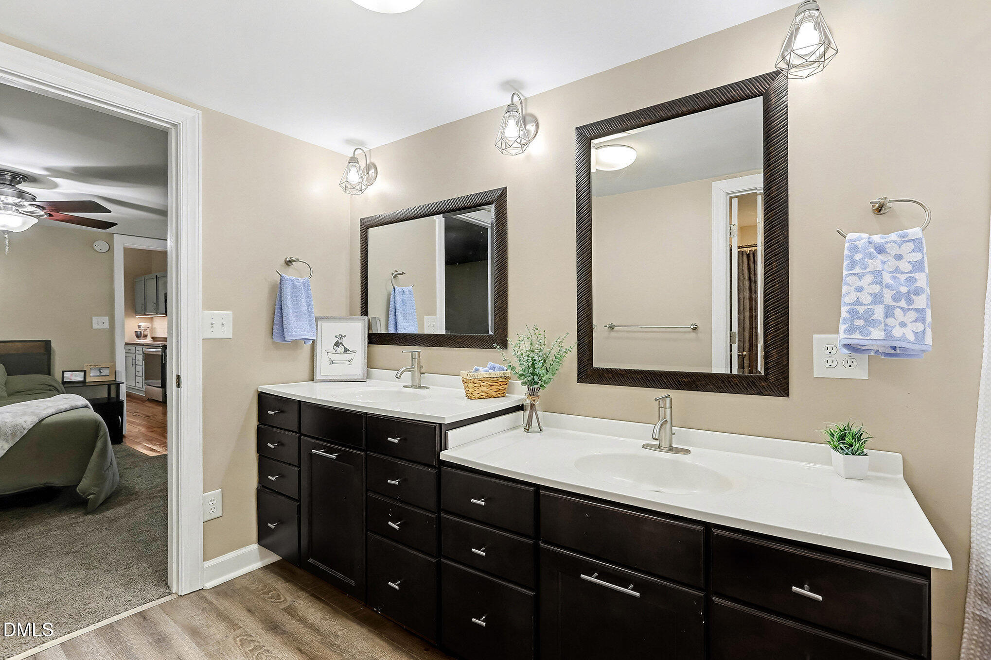7228 Cleveland School Road Garner, NC 27529 - Photo 21 of 28 a bathroom with a double vanity sink and a mirror