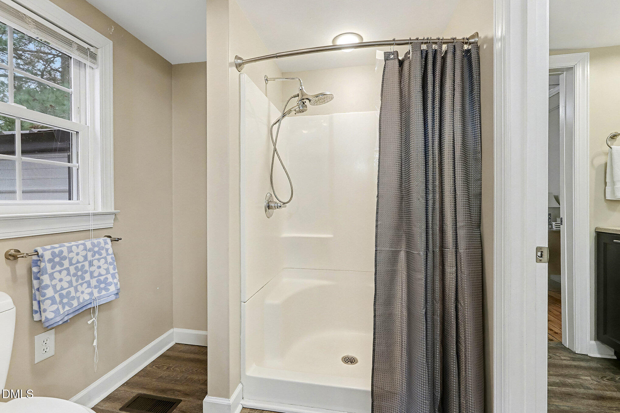 7228 Cleveland School Road Garner, NC 27529 - Photo 22 of 28 a bathroom with a shower