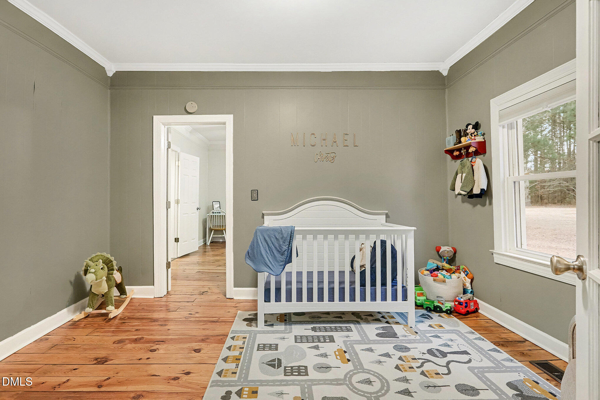 7228 Cleveland School Road Garner, NC 27529 - Photo 23 of 28 a bedroom with a bed and a window