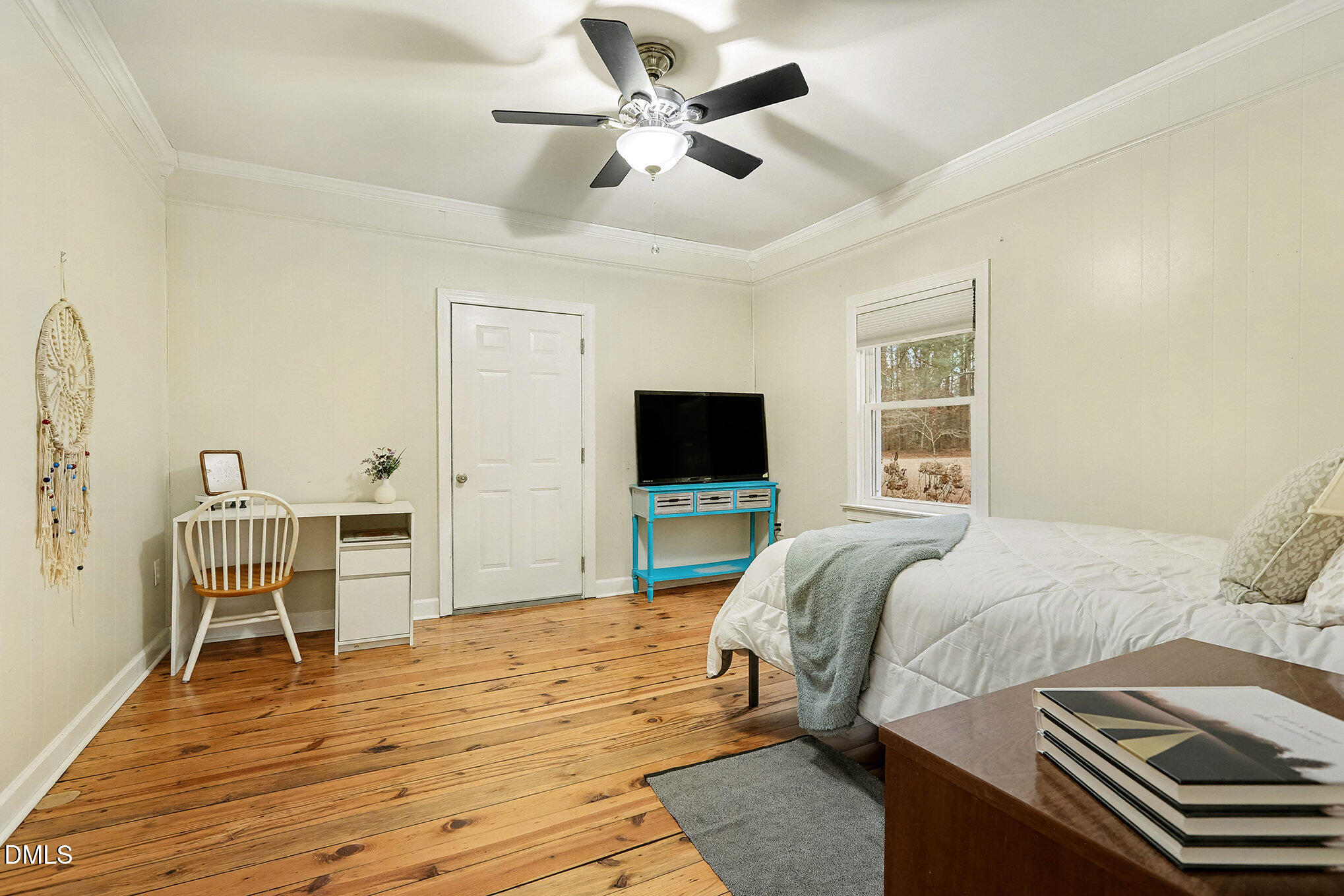 7228 Cleveland School Road Garner, NC 27529 - Photo 25 of 28 a bedroom with a bed and a flat screen tv
