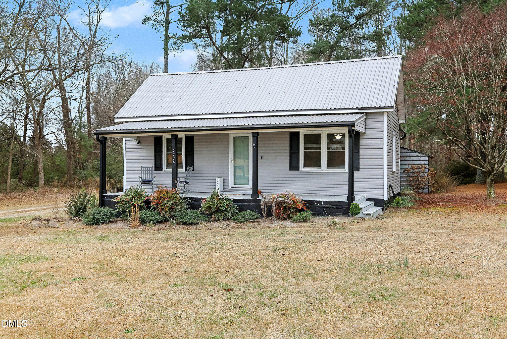 7228 Cleveland School Road Garner, NC 27529 - Photo 3 of 28 a front view of a house with garden