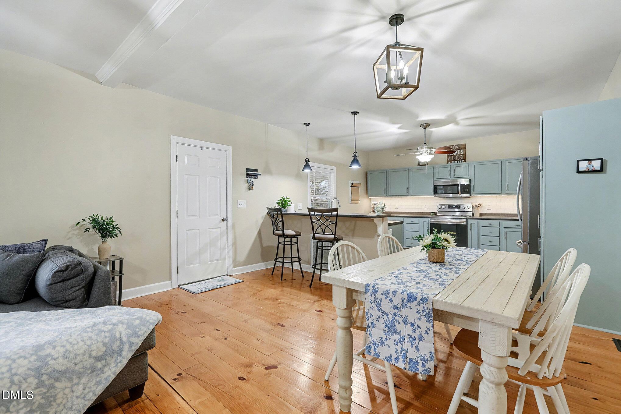 7228 Cleveland School Road Garner, NC 27529 - Photo 10 of 28 a large kitchen with a table and chairs in it