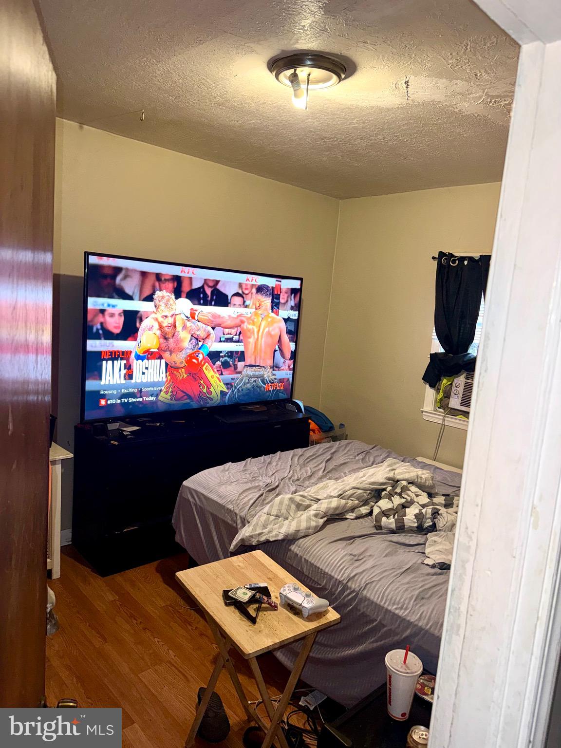 4515 Comly Street Philadelphia, PA 19135 - Photo 17 of 38 a living room with furniture and a flat screen tv
