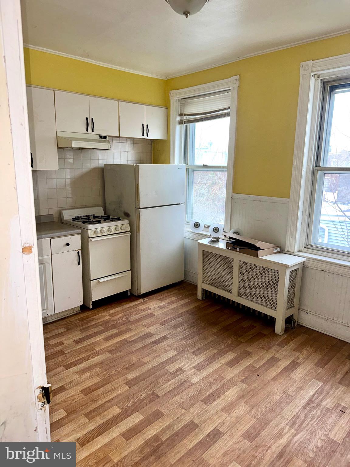 4515 Comly Street Philadelphia, PA 19135 - Photo 19 of 38 a kitchen with stainless steel appliances a stove a sink and a microwave
