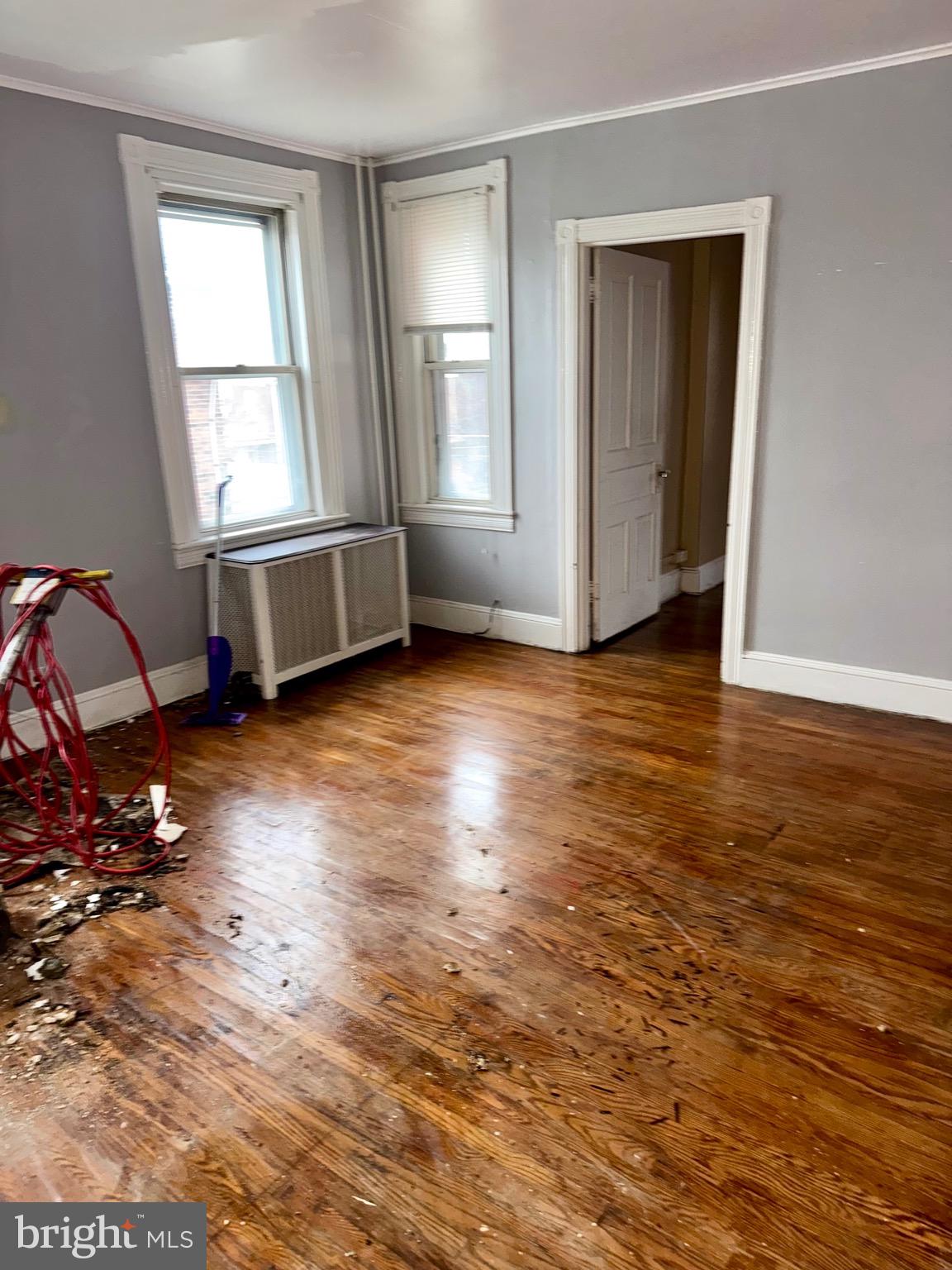 4515 Comly Street Philadelphia, PA 19135 - Photo 20 of 38 an empty room with wooden floor and windows