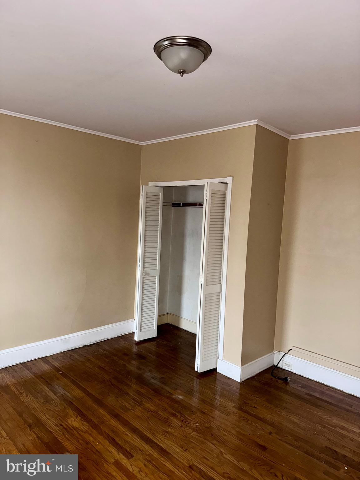 4515 Comly Street Philadelphia, PA 19135 - Photo 29 of 38 a view of an empty room with wooden floor and a window
