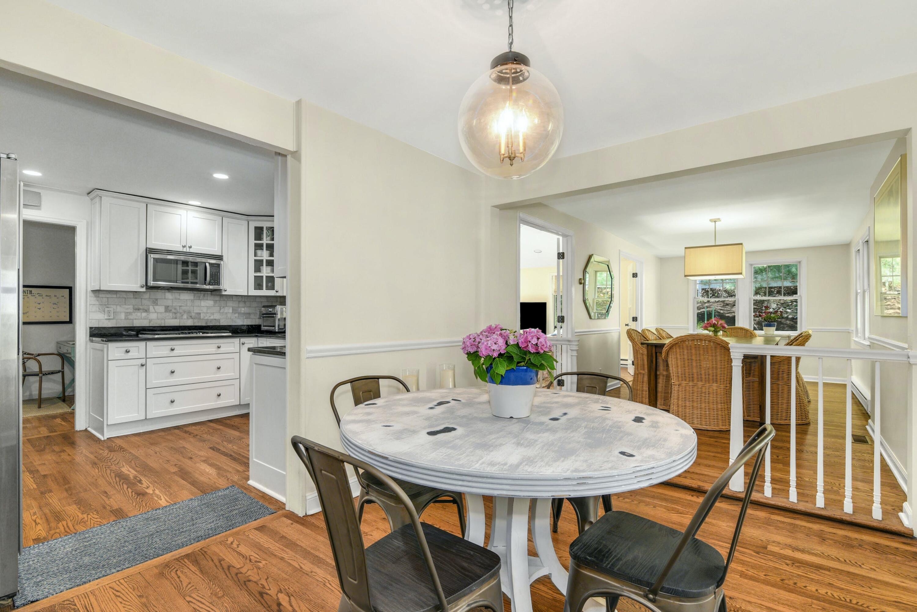 1 Fairmead Road Darien, CT 06820 - Photo 11 of 40 a kitchen with kitchen island a dining table and chairs
