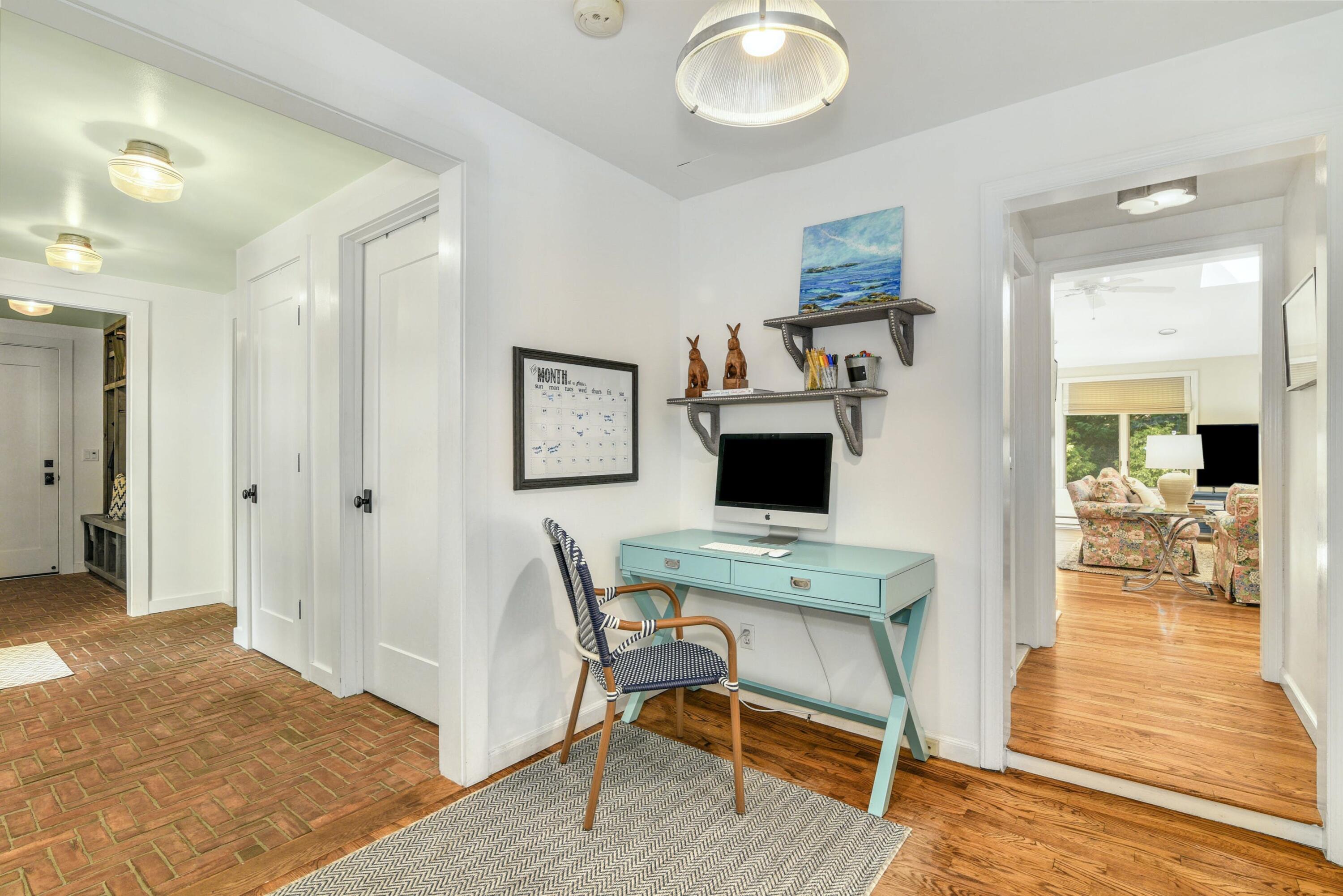 1 Fairmead Road Darien, CT 06820 - Photo 18 of 40 a workspace with furniture and wooden floor