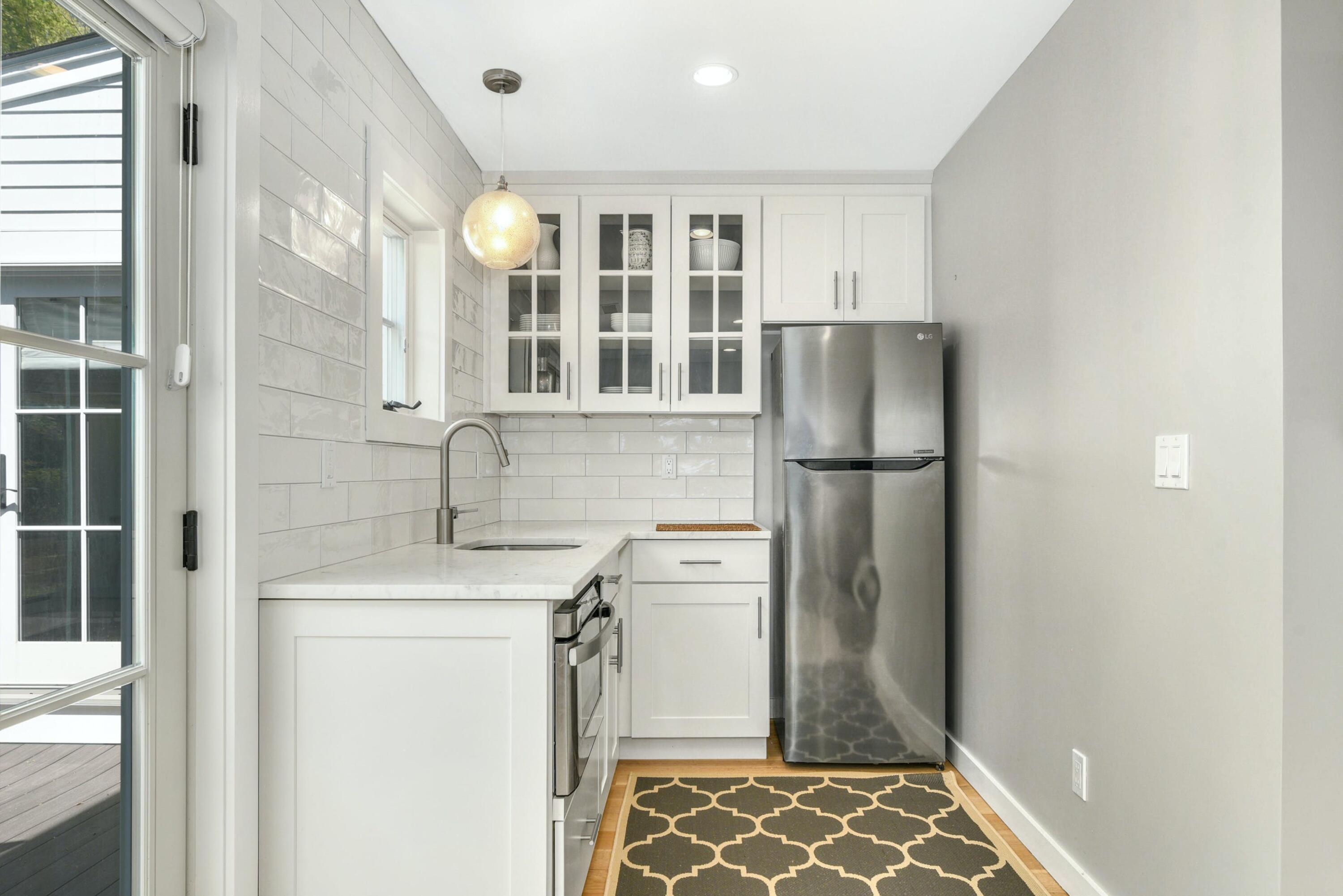 1 Fairmead Road Darien, CT 06820 - Photo 24 of 40 a kitchen with a refrigerator and a sink