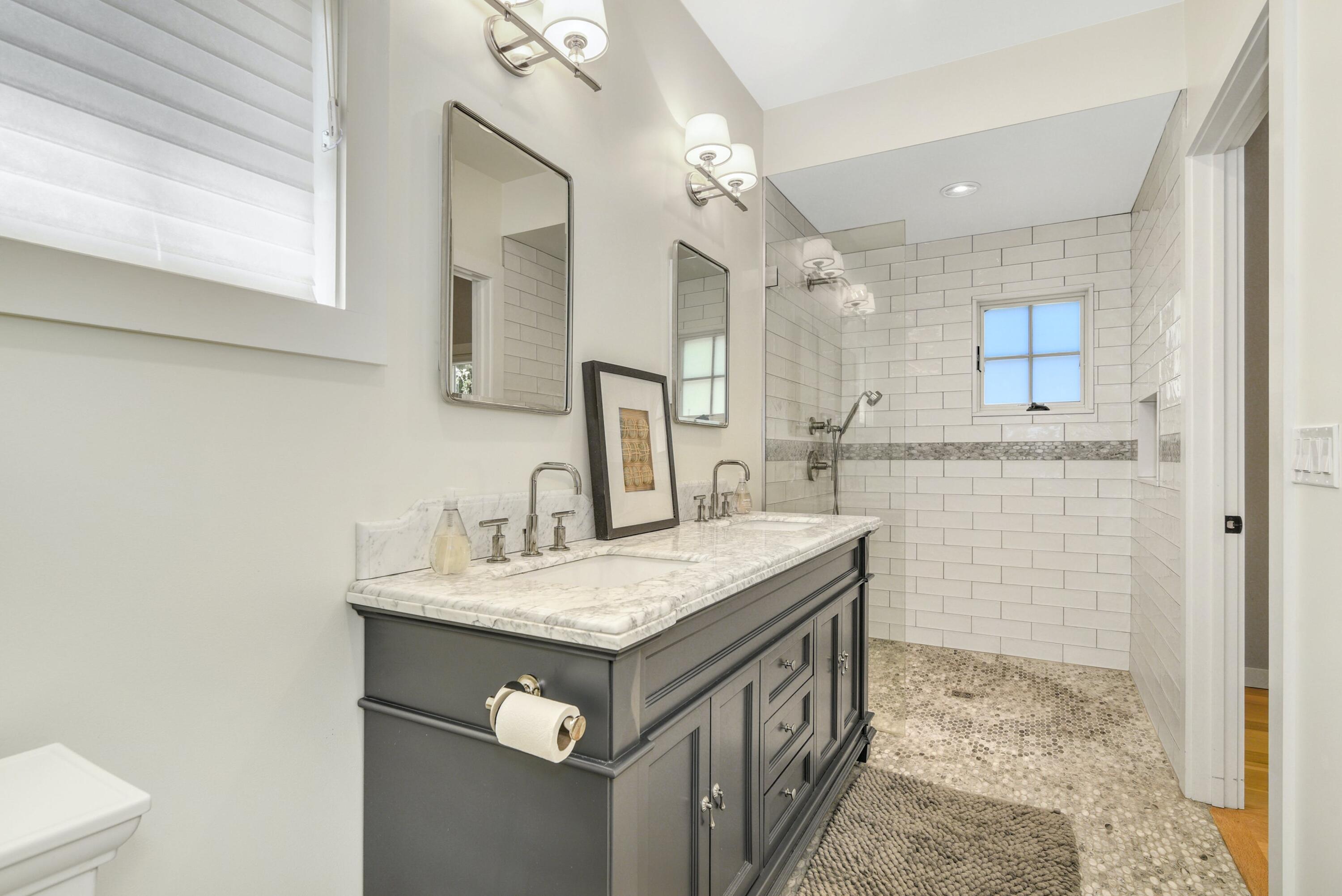 1 Fairmead Road Darien, CT 06820 - Photo 26 of 40 a bathroom with a sink a vanity and a mirror