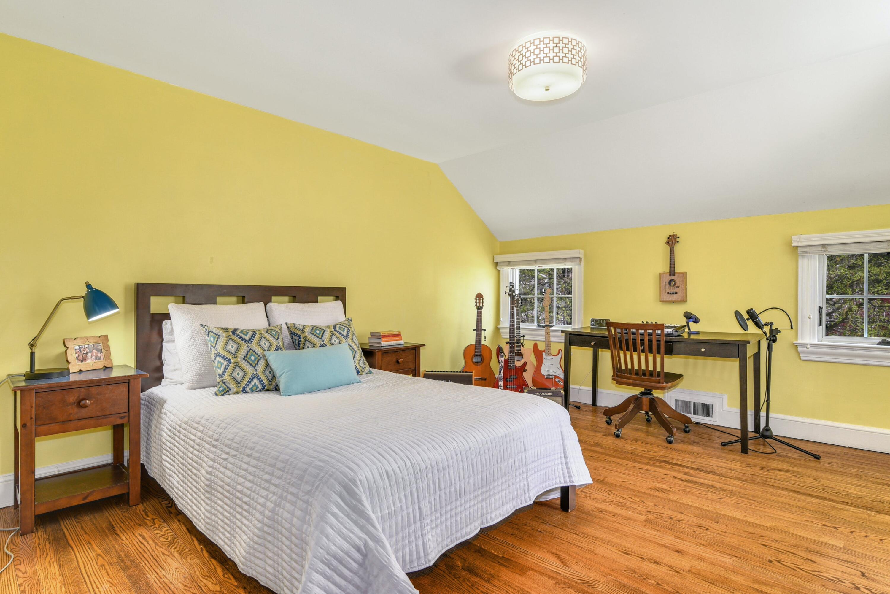 1 Fairmead Road Darien, CT 06820 - Photo 31 of 40 a bedroom with a bed and wooden floor