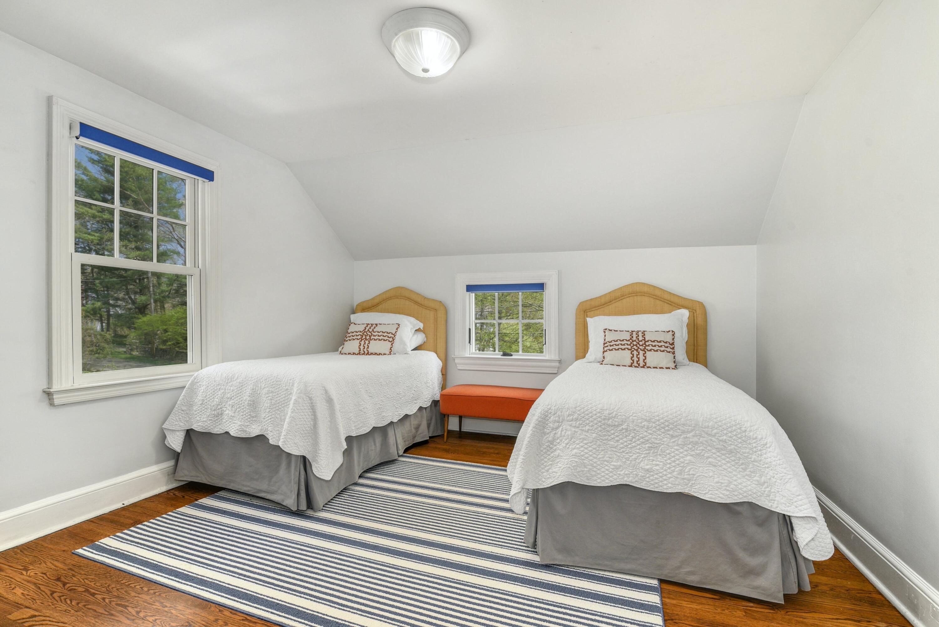 1 Fairmead Road Darien, CT 06820 - Photo 32 of 40 a bedroom with two beds and a window