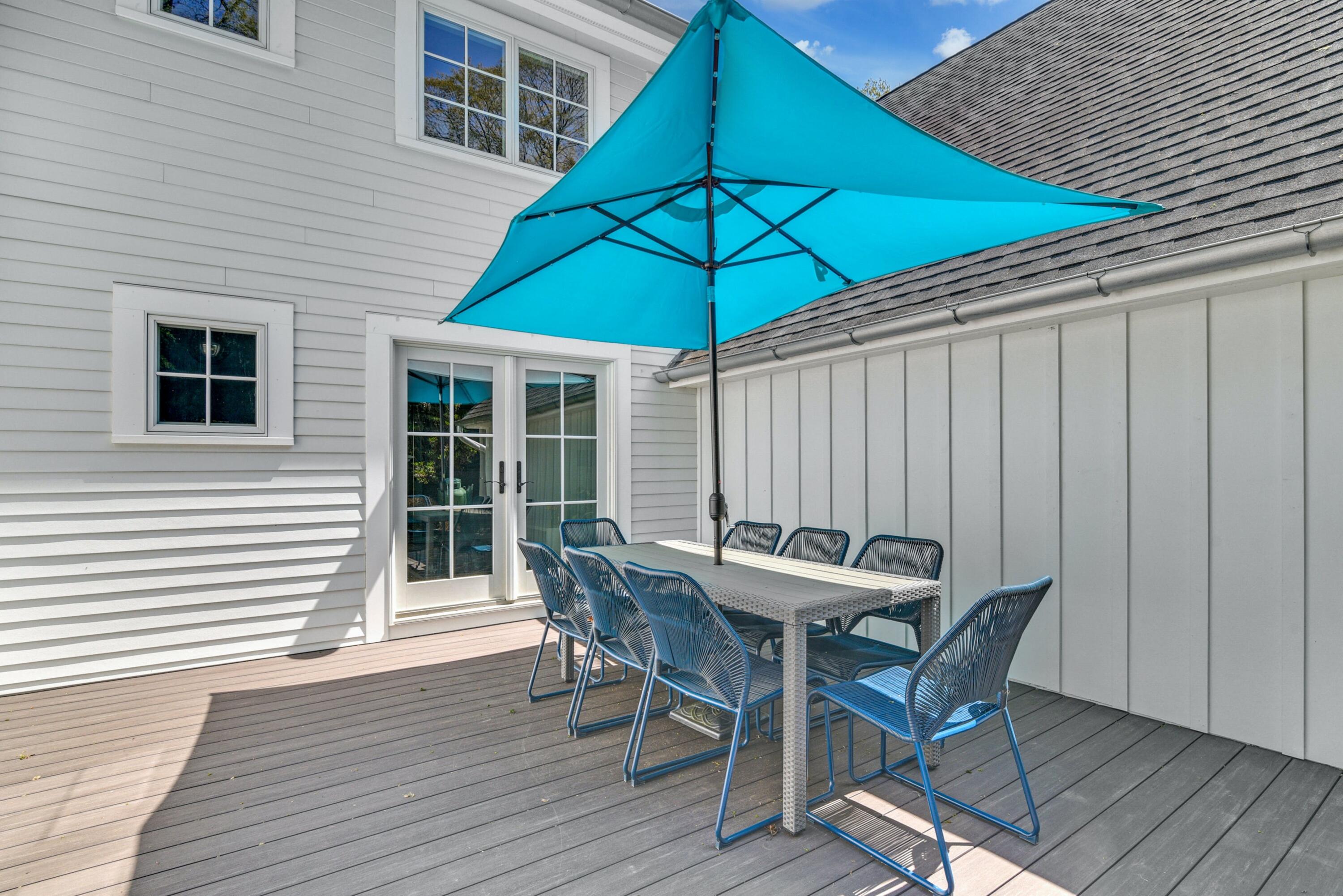 1 Fairmead Road Darien, CT 06820 - Photo 35 of 40 a patio with a table and chairs