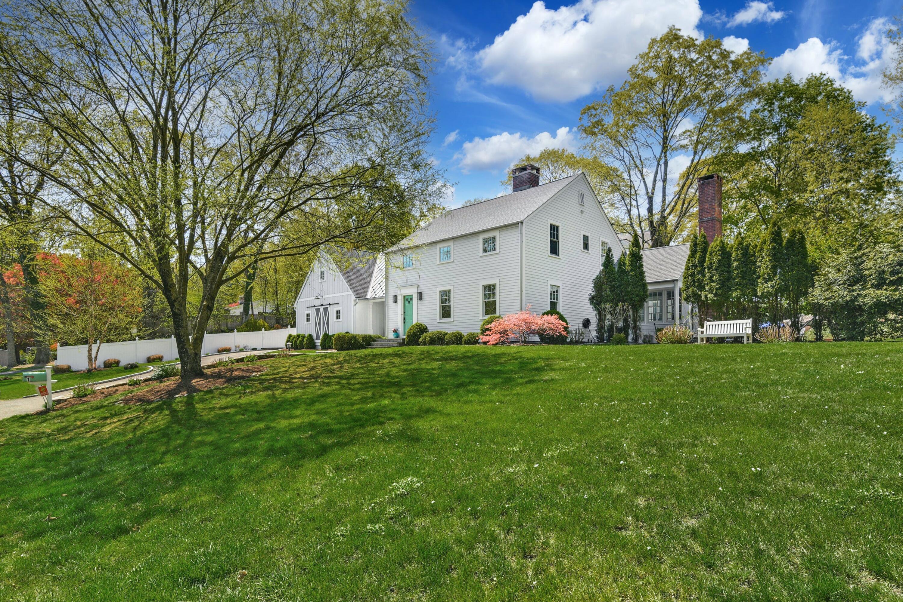 1 Fairmead Road Darien, CT 06820 - Photo 40 of 40 a view of a white house with a big yard and large trees