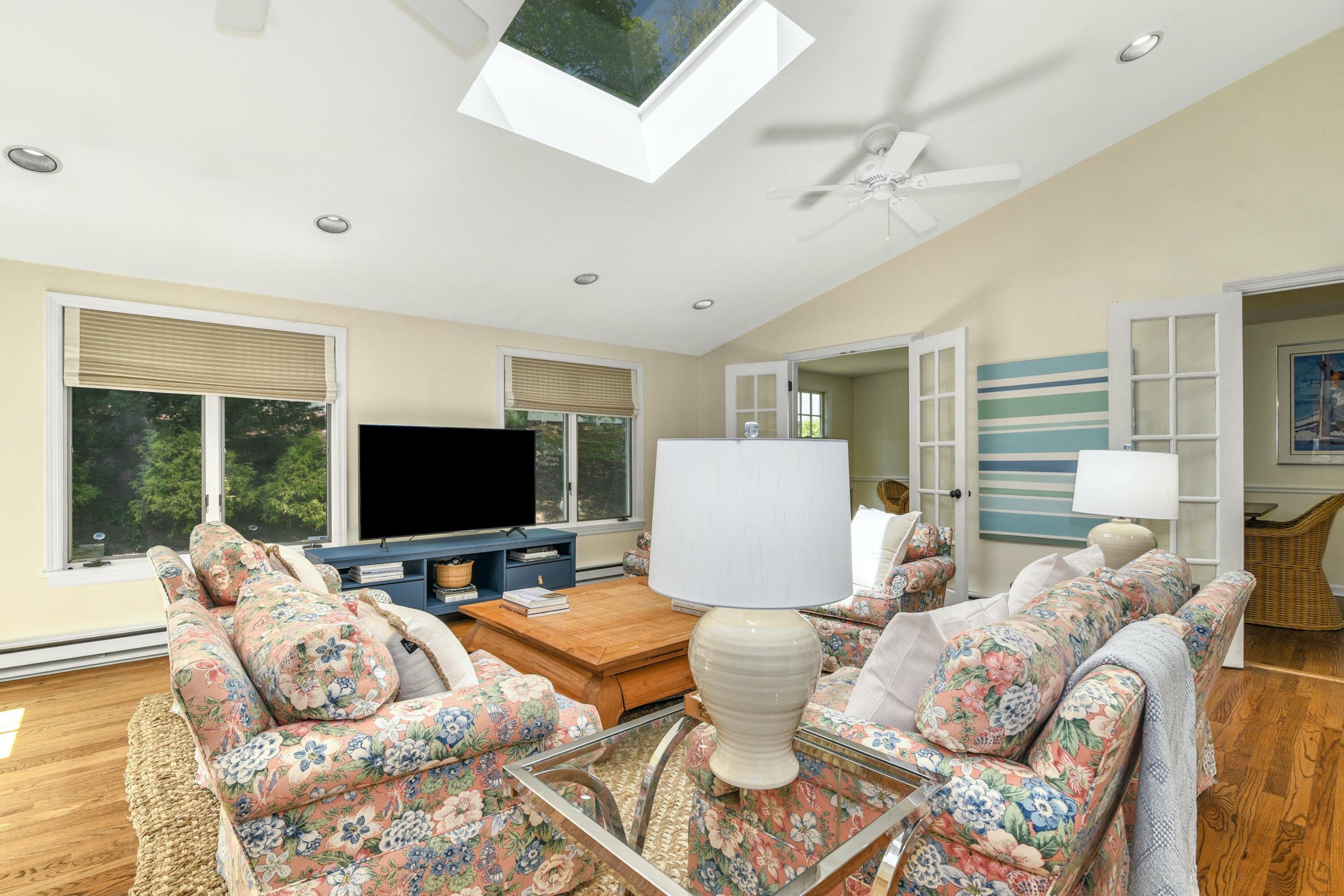 1 Fairmead Road Darien, CT 06820 - Photo 7 of 40 a living room with furniture and a flat screen tv