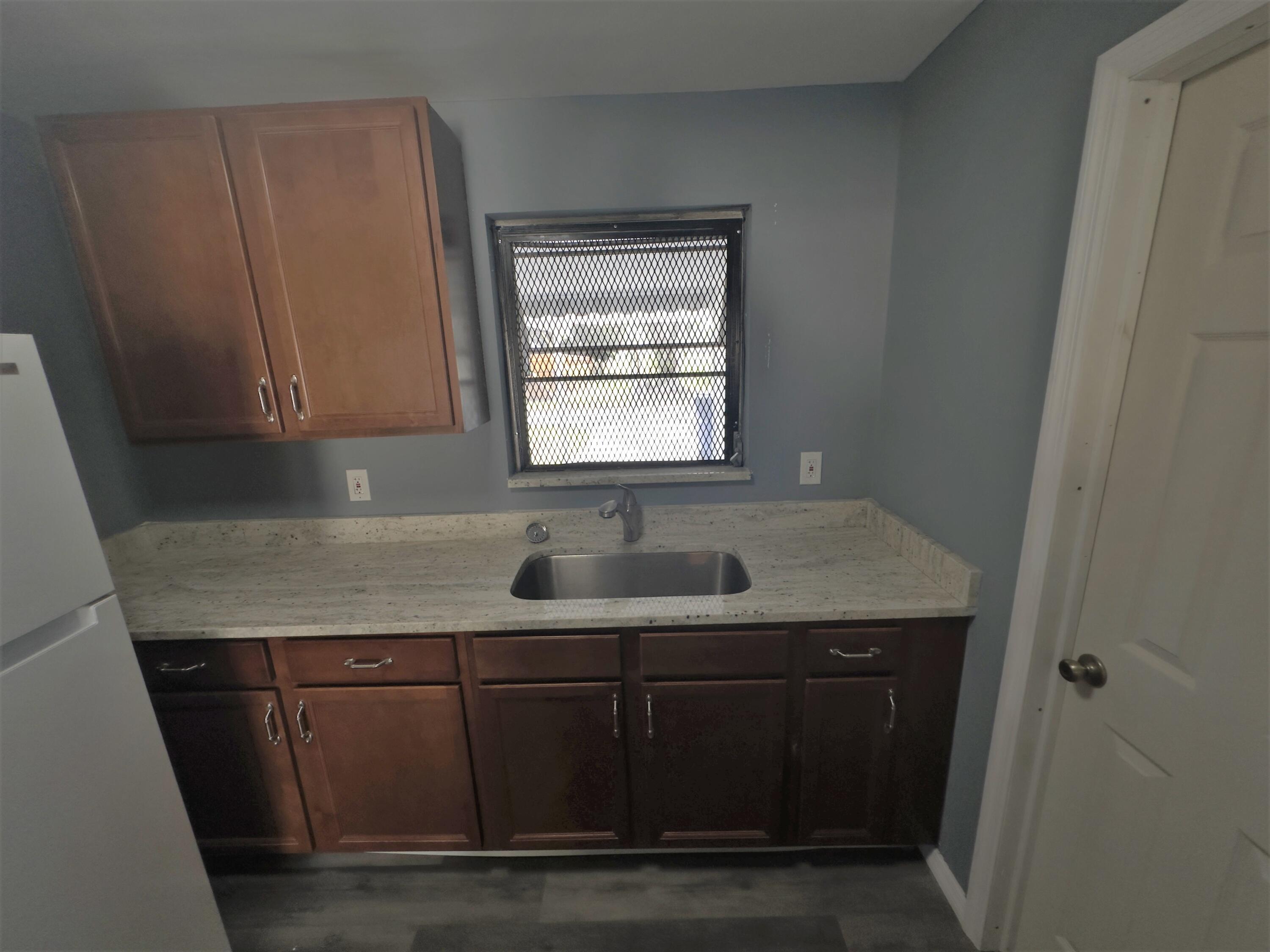 521 Silver Beach Road Riviera Beach, FL 33403 - Photo 8 of 10 521 Kitchen 2