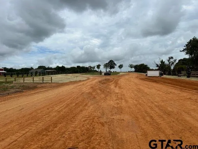 a view of a lake with houses in the back