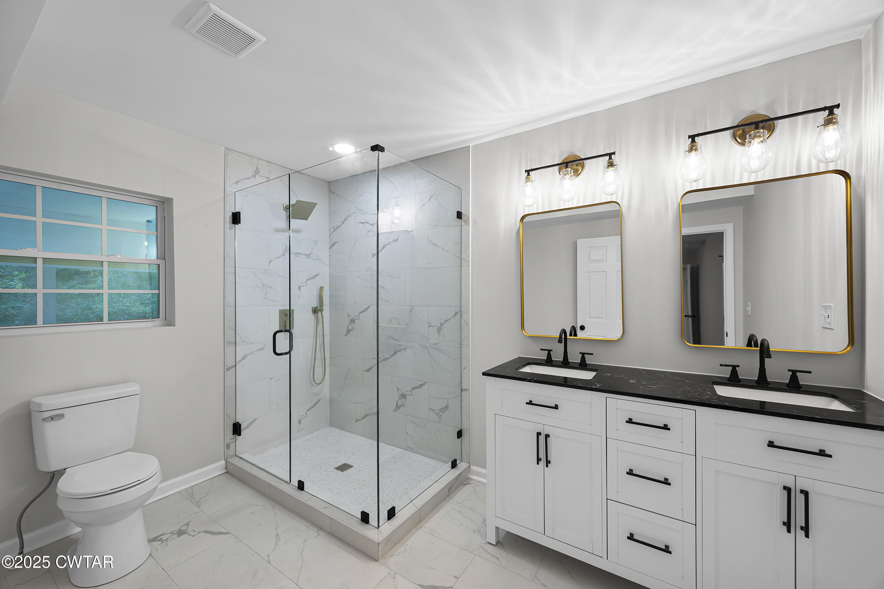 144 McLeary Road Jackson, TN 38305 - Photo 12 of 23 a bathroom with a double vanity sink toilet mirror and shower