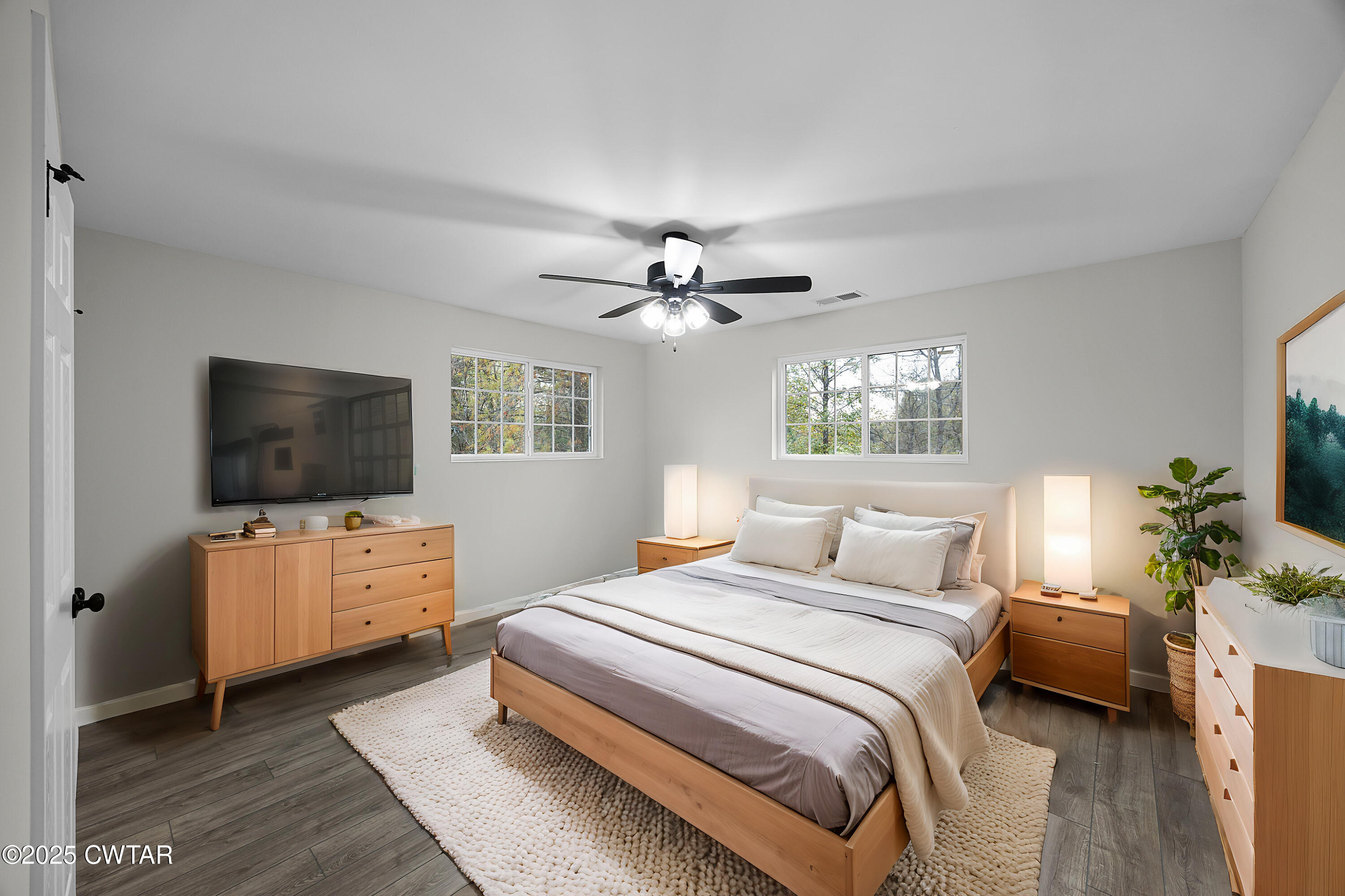 144 McLeary Road Jackson, TN 38305 - Photo 16 of 23 a bedroom with a bed and a flat screen tv
