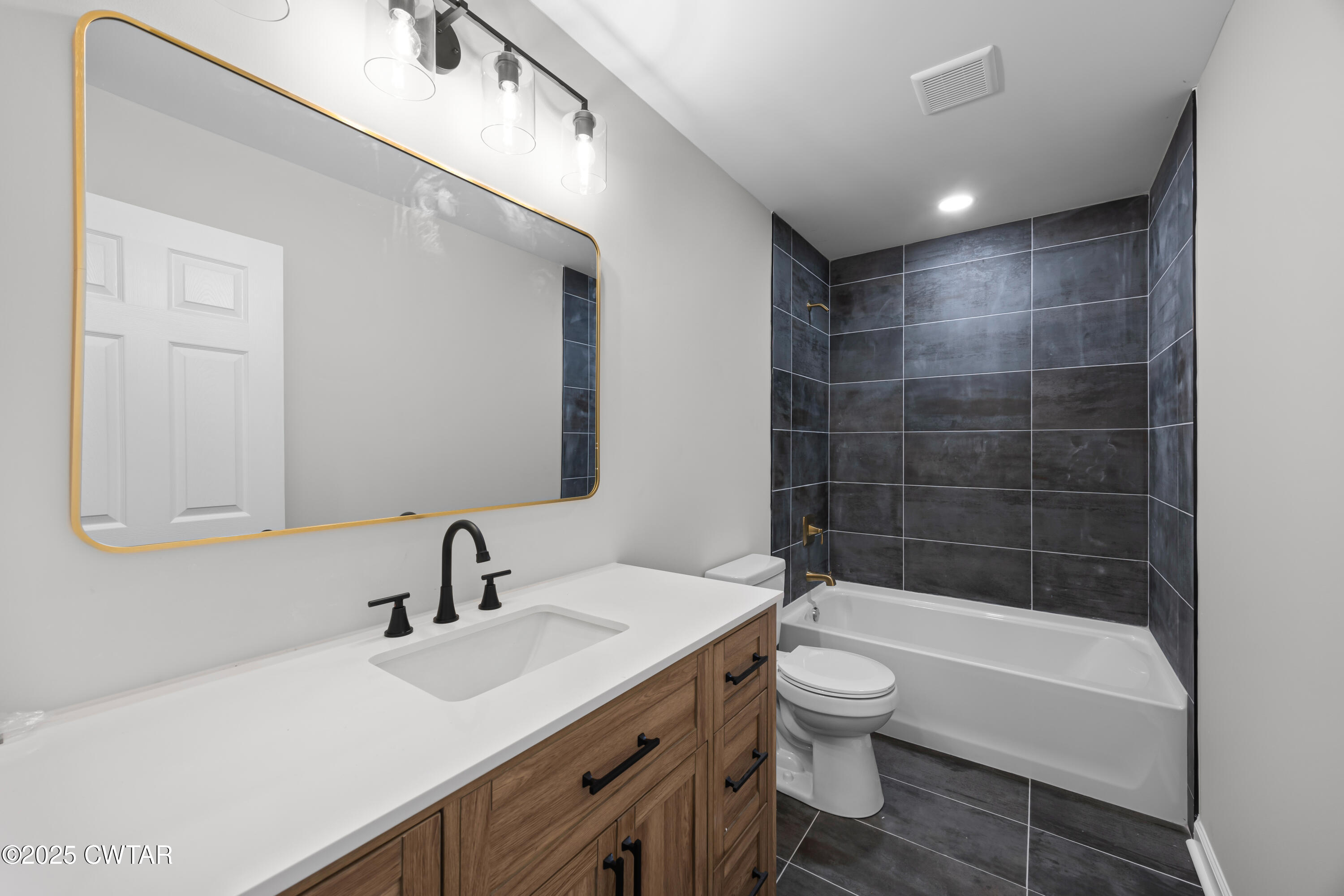 144 McLeary Road Jackson, TN 38305 - Photo 18 of 23 a bathroom with a sink a toilet and shower