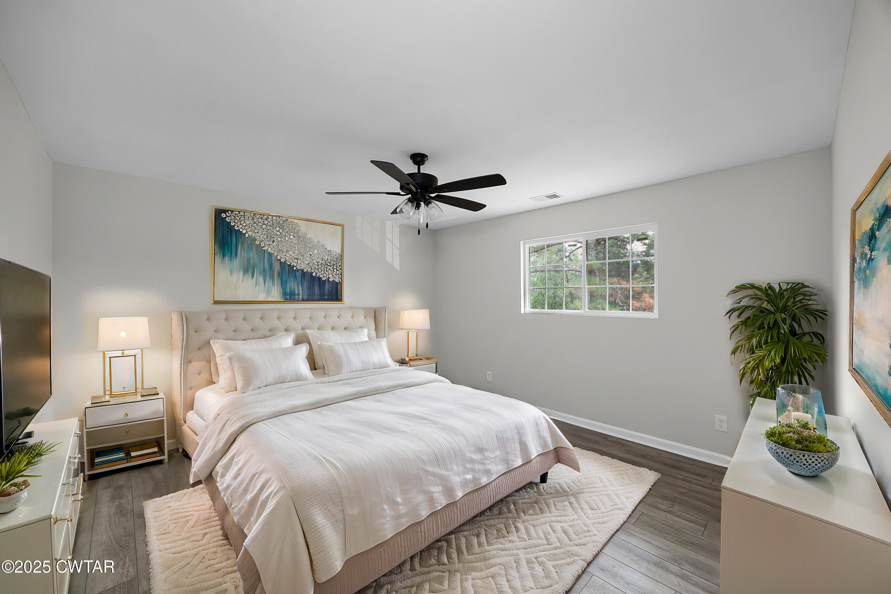 144 McLeary Road Jackson, TN 38305 - Photo 21 of 23 a bedroom with a bed and a potted plant