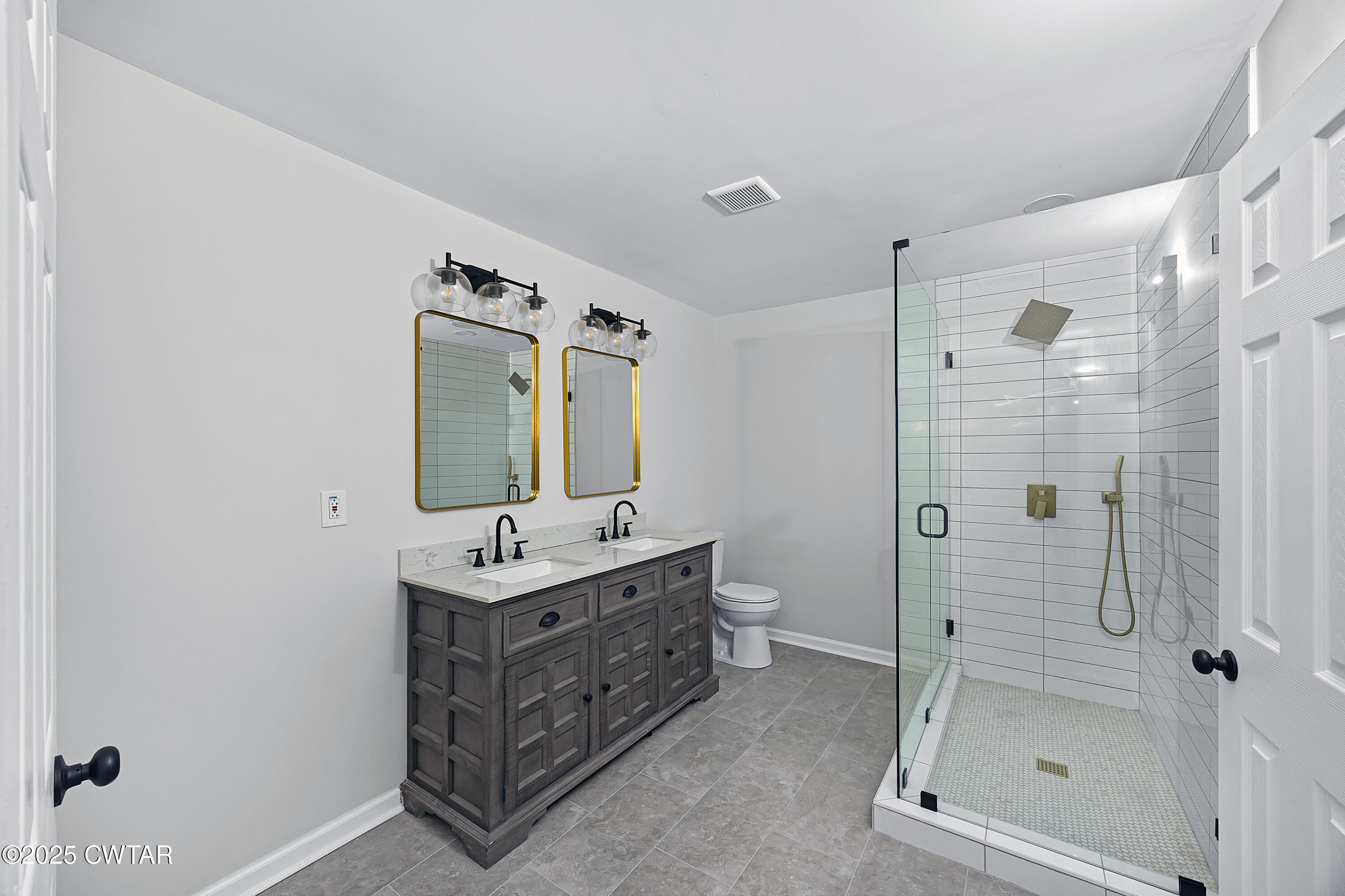 144 McLeary Road Jackson, TN 38305 - Photo 22 of 23 a bathroom with a shower sink and mirror