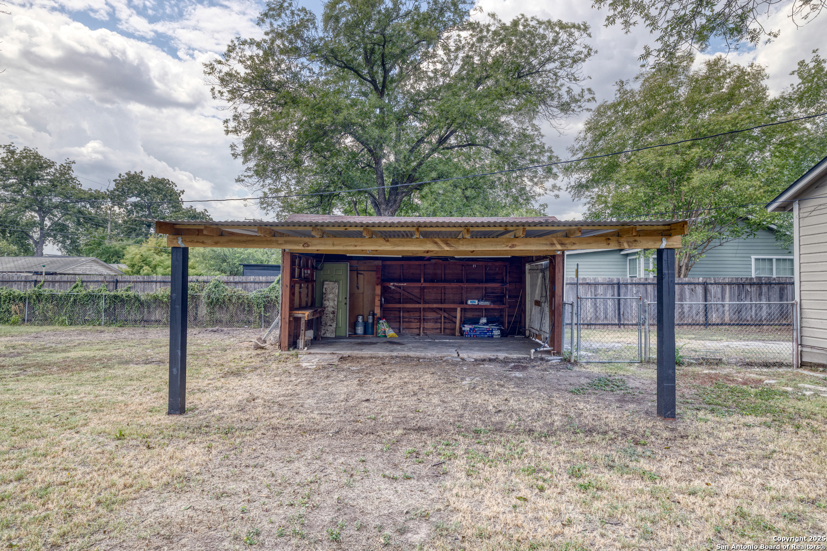 829 Maple Street Uvalde, TX 78801 - Photo 23 of 33 a view of a house with a backyard