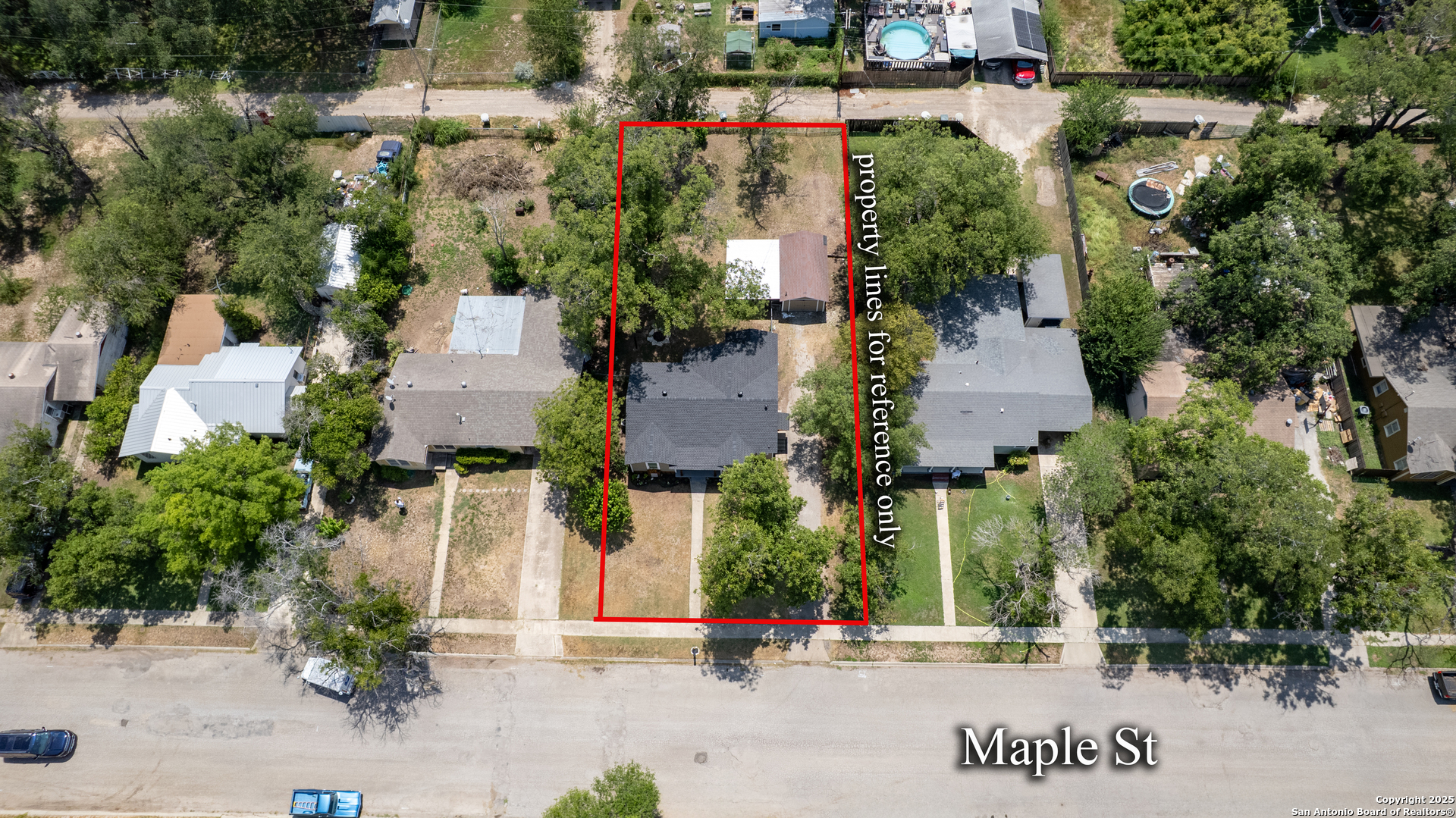 829 Maple Street Uvalde, TX 78801 - Photo 29 of 33 an aerial view of streets and trees