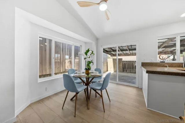 a dining room with furniture and window