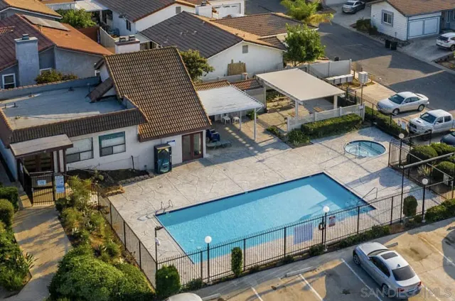 an aerial view of a house with sitting area