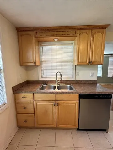 a kitchen with a sink and a window