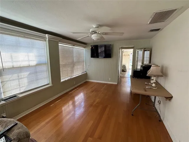 a view of a livingroom with furniture and wooden floor