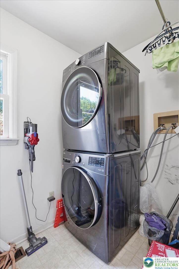 808 Hunter Road Easton, PA 18040 - Photo 28 of 41 A dedicated laundry room featuring a modern stacked washer and dryer, simplifying household chores.