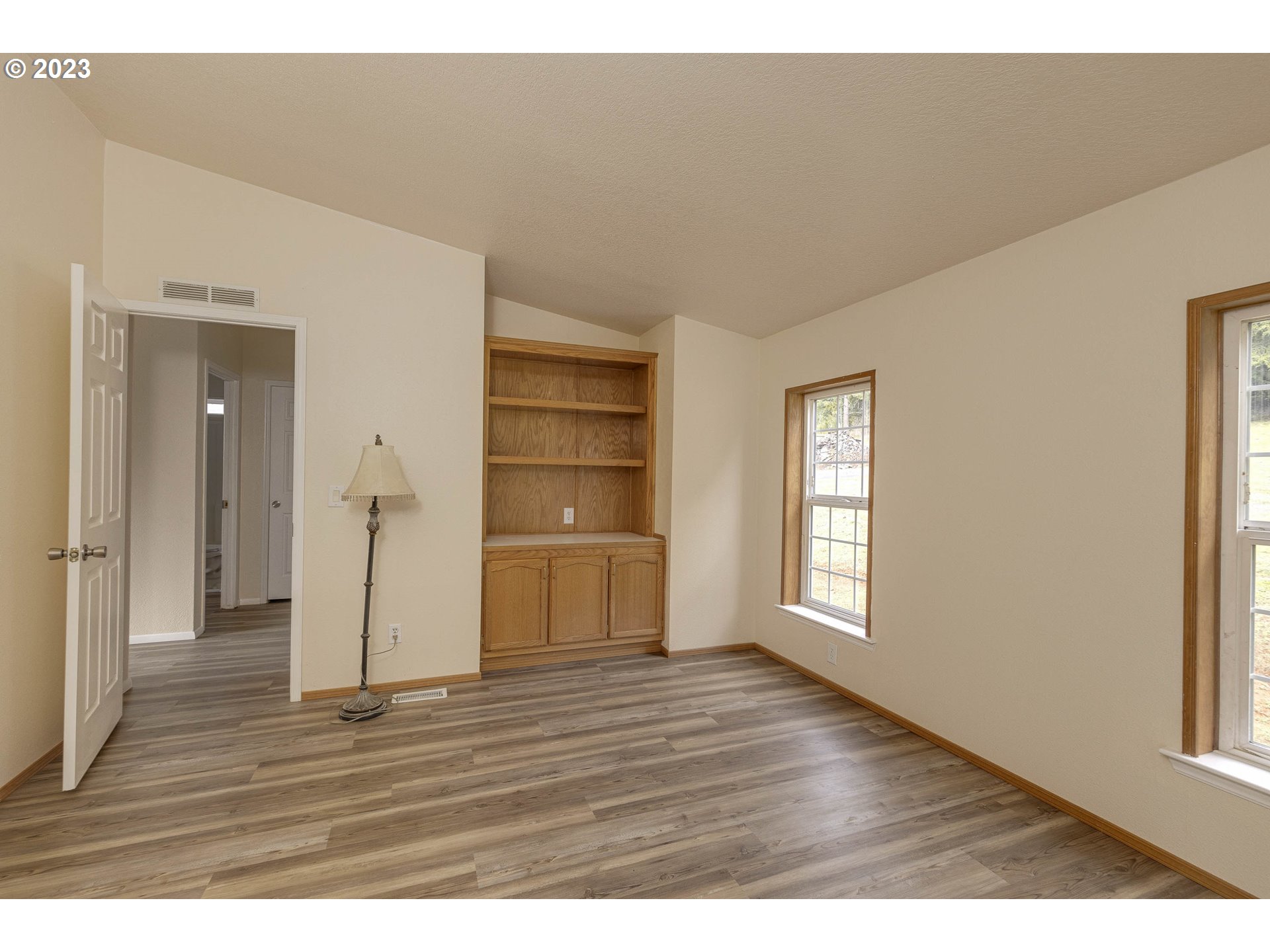 23246 Gooseneck Road Sheridan, OR 97378 - Photo 17 of 27 a view of empty room with wooden floor and window