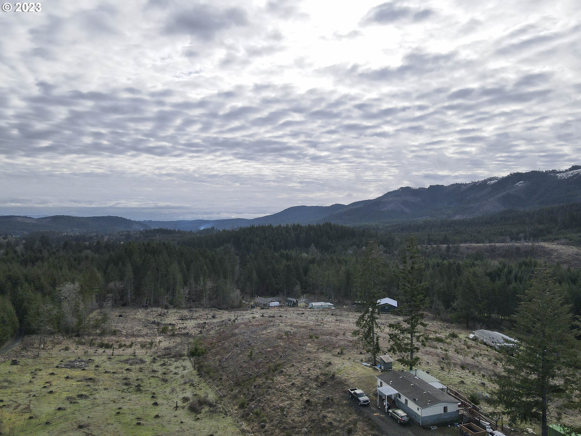 23246 Gooseneck Road Sheridan, OR 97378 - Photo 18 of 27 a view of a lake with mountains in the background
