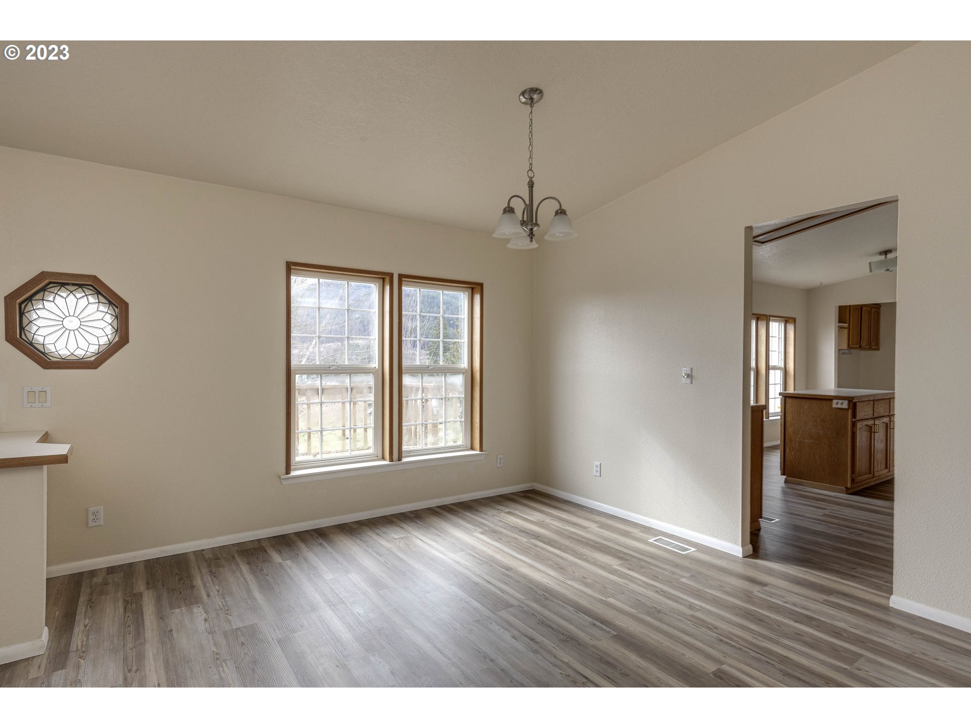 23246 Gooseneck Road Sheridan, OR 97378 - Photo 3 of 27 a view of an empty room with window and wooden floor