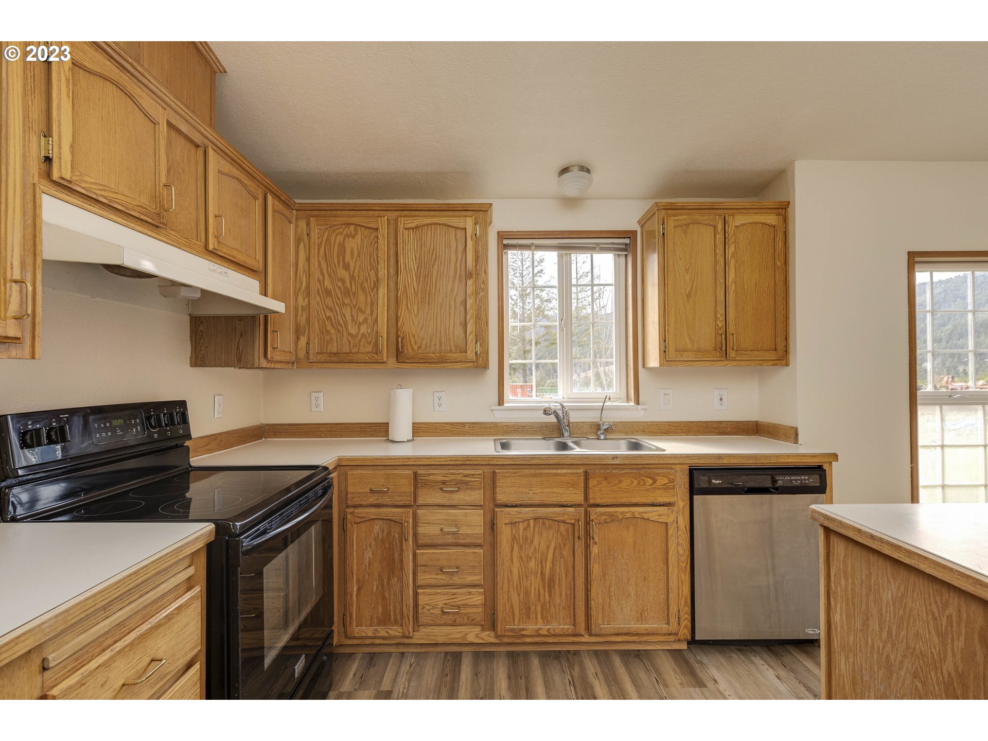 23246 Gooseneck Road Sheridan, OR 97378 - Photo 7 of 27 a kitchen with stainless steel appliances granite countertop a sink stove and cabinets