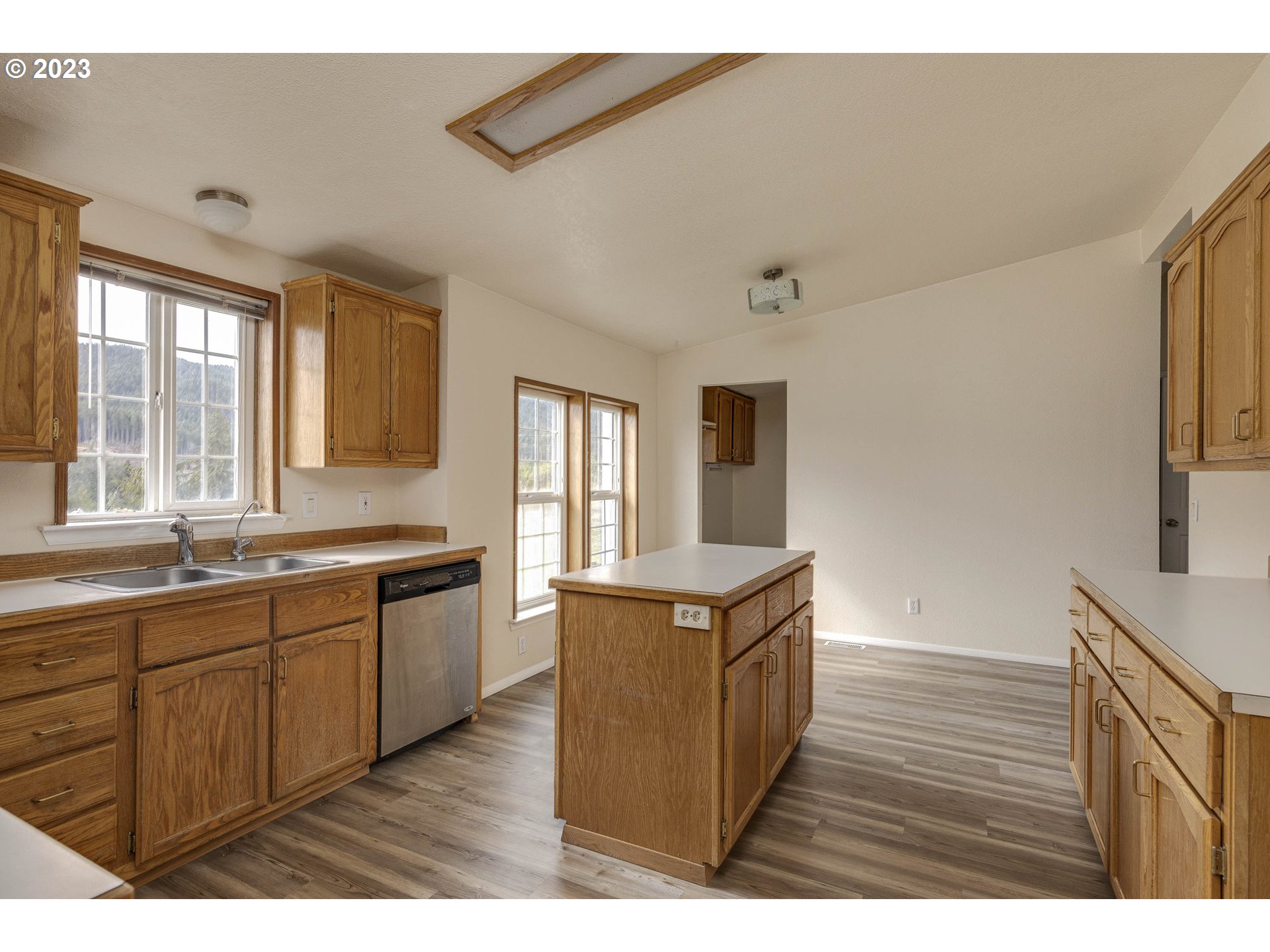 23246 Gooseneck Road Sheridan, OR 97378 - Photo 8 of 27 a kitchen with stainless steel appliances granite countertop a sink and wooden cabinets