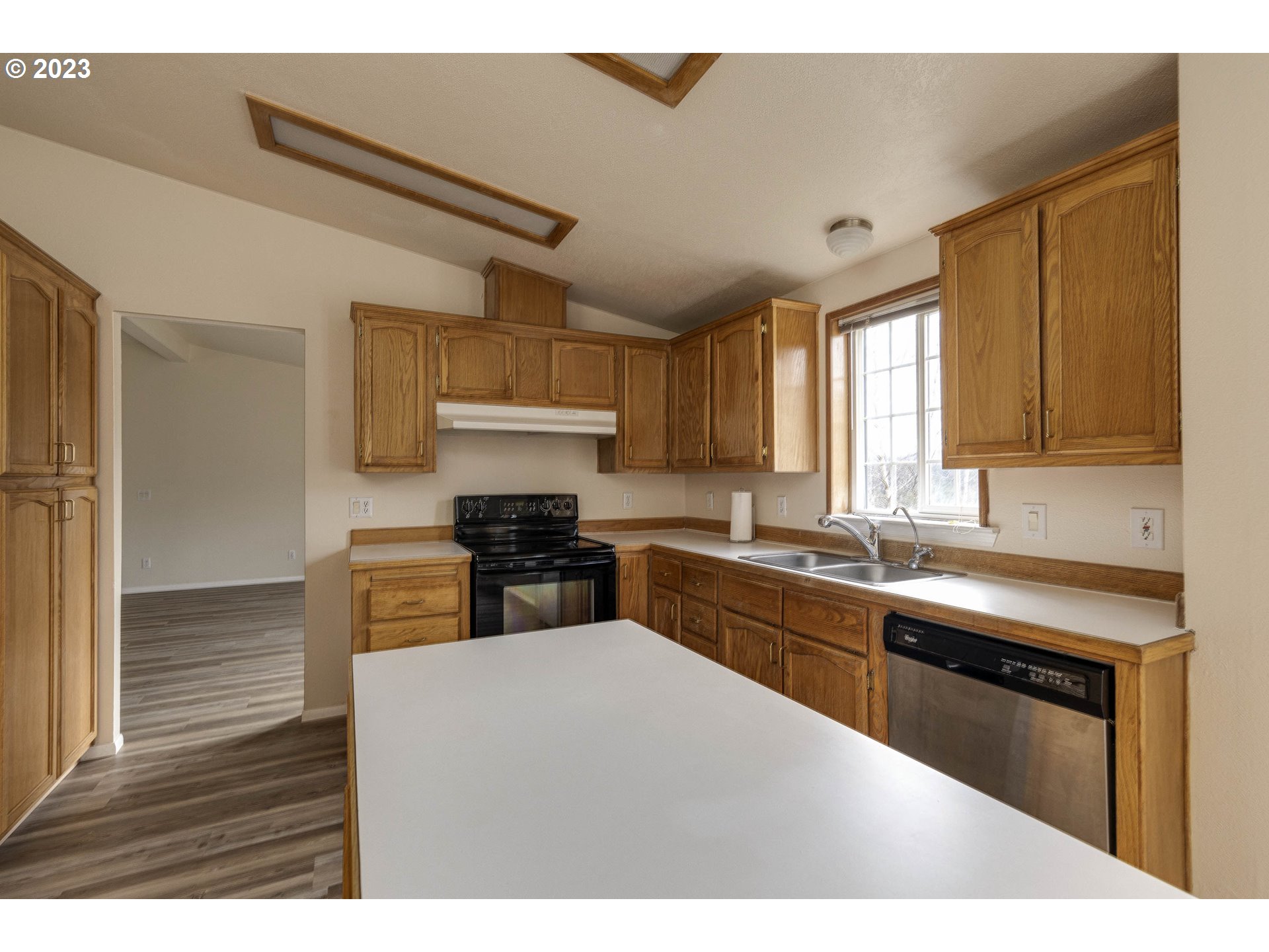 23246 Gooseneck Road Sheridan, OR 97378 - Photo 9 of 27 a kitchen with stainless steel appliances granite countertop a sink stove and refrigerator