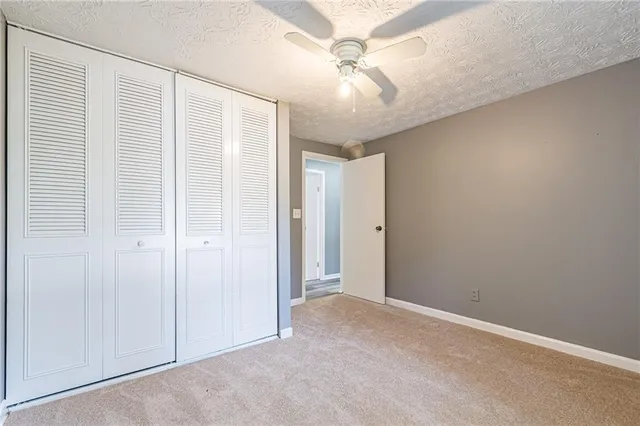 an empty room with fan