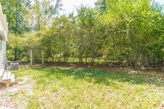 a view of swimming pool from a yard