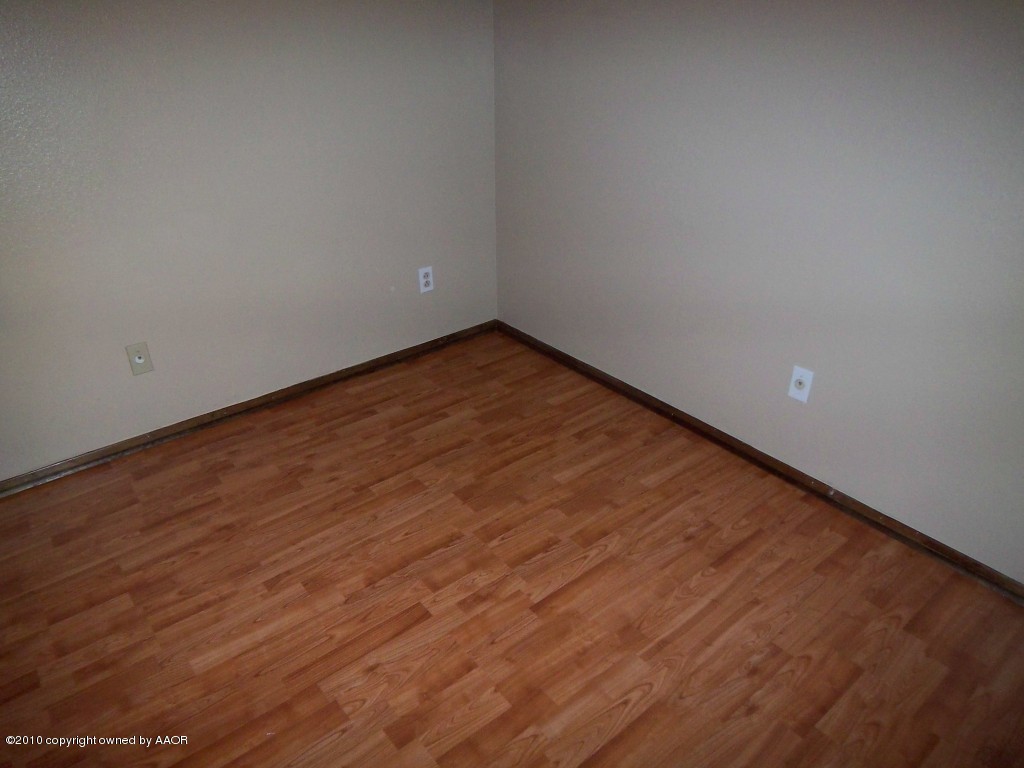 5203 South Fannin Street Amarillo, TX 79110 - Photo 17 of 18 Laminate Wood Flooring in Master Bedroom