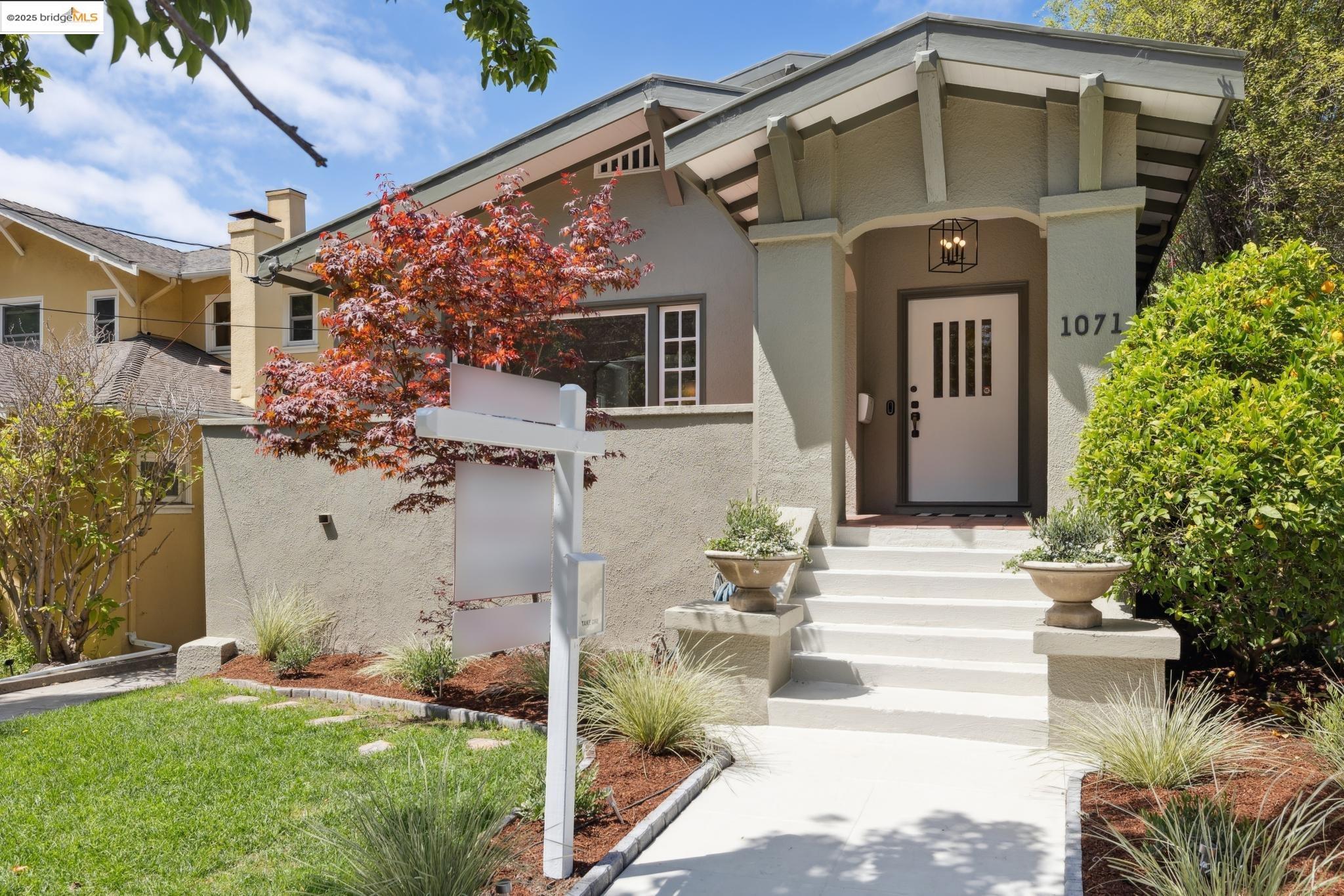1071 Harvard Road Piedmont, CA 94610 - Photo 1 of 1 front view of a house with a small yard