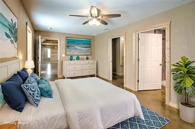 a bedroom with a bed potted plant with the outer view