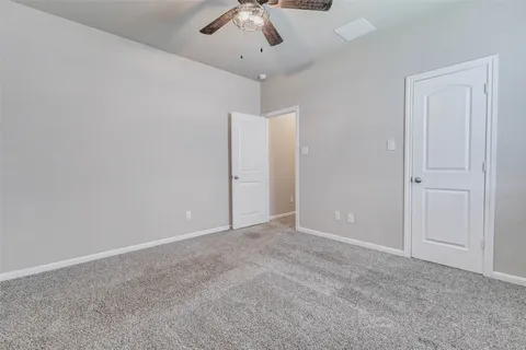 an empty room with closet area