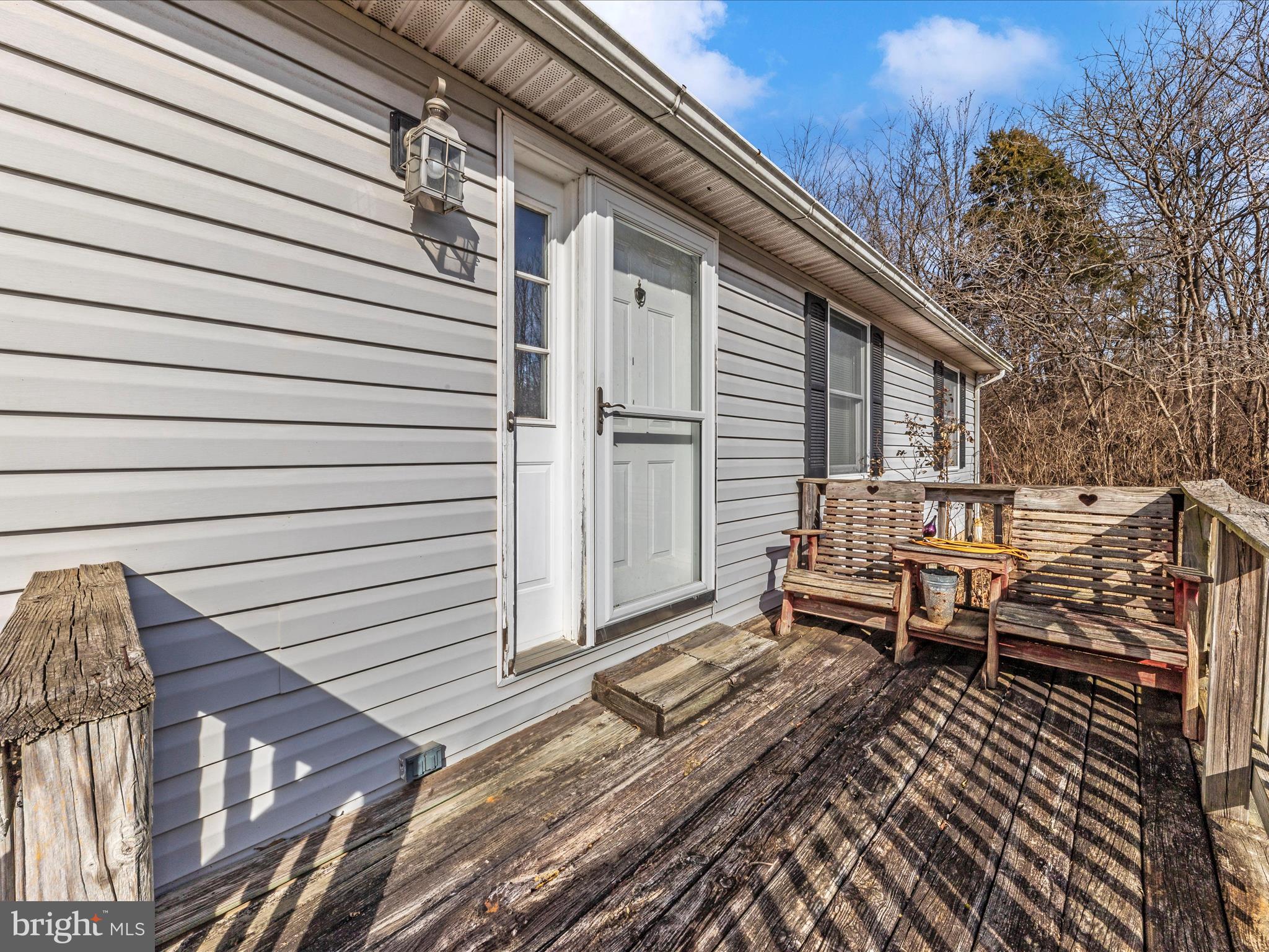 12258 St Paul Road Clear Spring, MD 21722 - Photo 6 of 15 a view of a wooden chairs on the roof deck