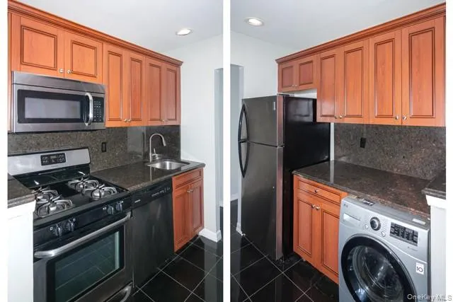 a kitchen with stainless steel appliances granite countertop a refrigerator stove and sink