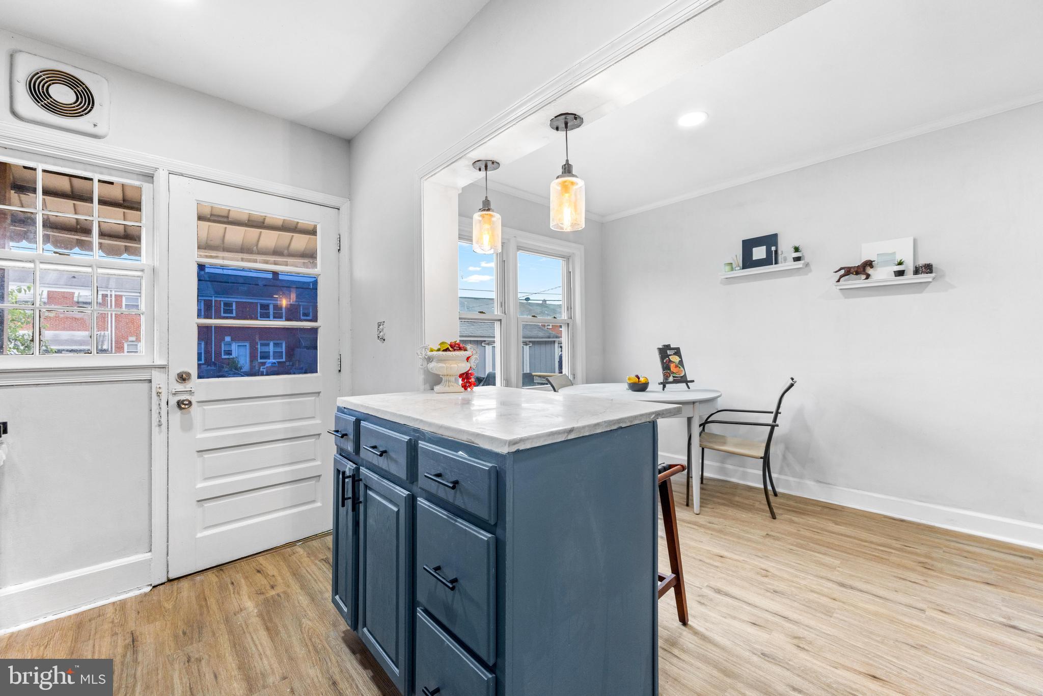 2134 Firethorn Road Middle River, MD 21220 - Photo 13 of 41 a view of kitchen island with furniture and wooden floor