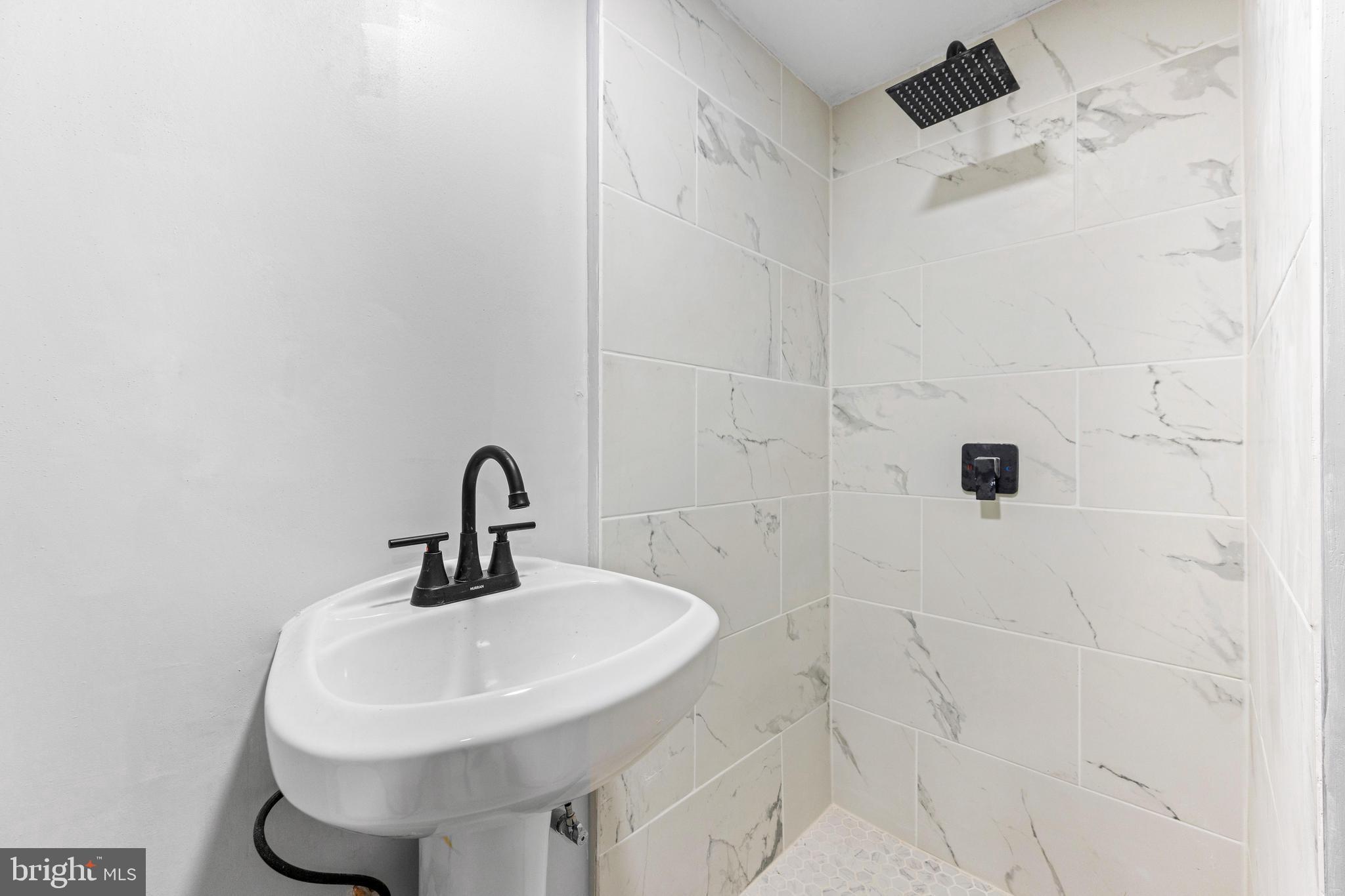 2134 Firethorn Road Middle River, MD 21220 - Photo 19 of 41 a bathroom with a sink shower and a mirror